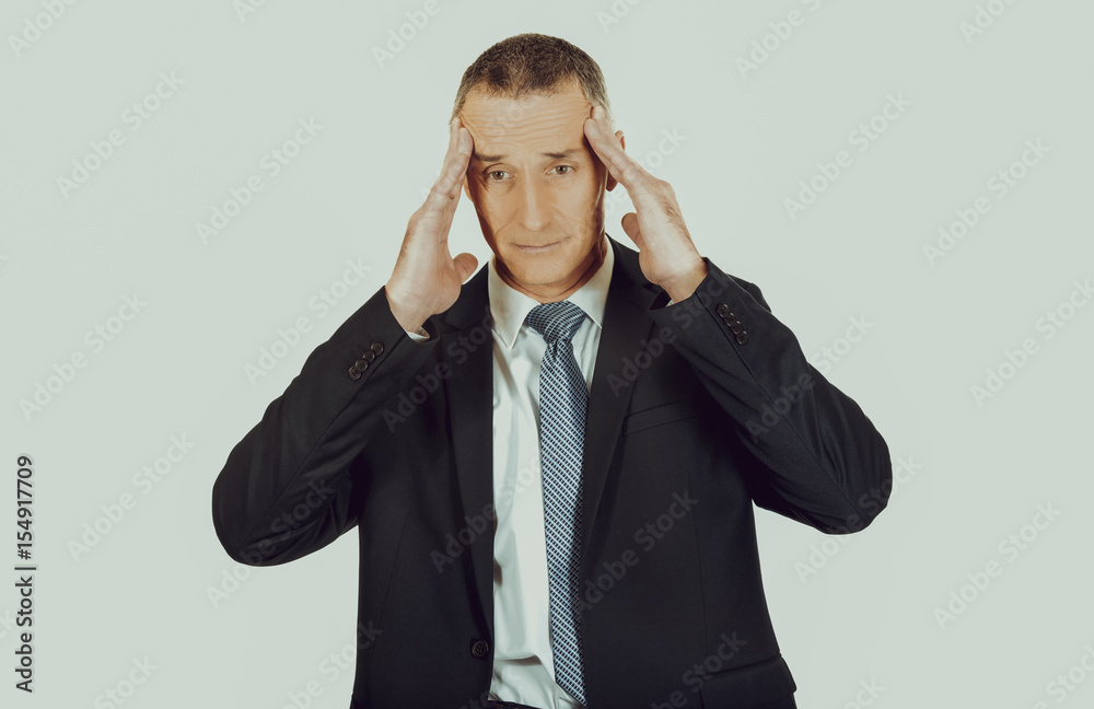 Businessman suffering from headache Businessman suffering from headache
