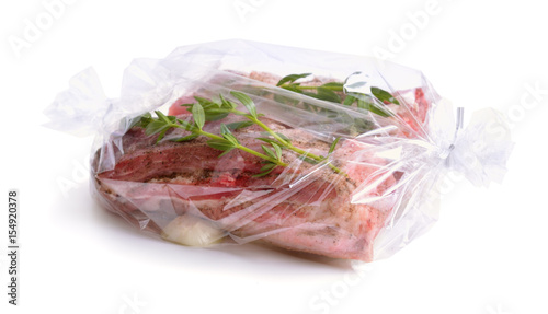 Fotografija Fresh meat packaged in a sleeve for baking