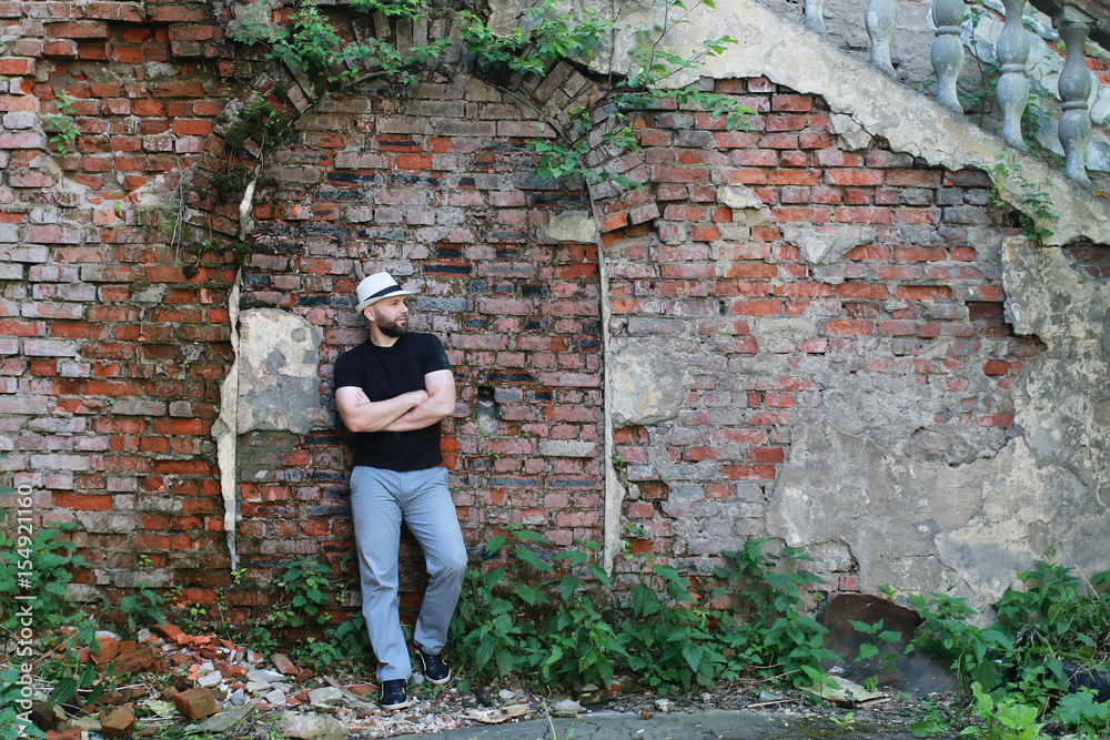 old brick wall man stand