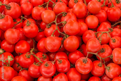 Fresh tomatoes organic at outdoor market. Top view. Close-up