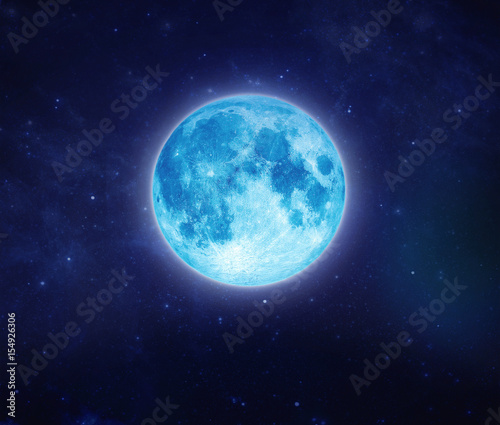 Beautiful blue moon on sky and star at night. Outdoors at night. Full lunar shine moonlight at nighttime with copy space background for headline text and graphic design. © somchaisom