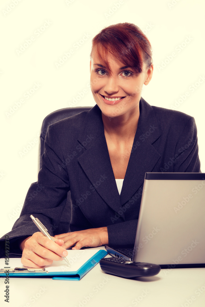 Young attractive business woman using laptop at the office Young attractive business woman using laptop at the office
