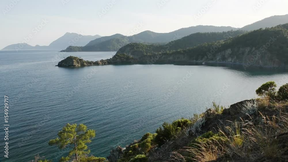 Picturesque Mediterranean seascape in Turkey. View of a small bay near the Tekirova village, District of Kemer, Antalya Province. Picturesque Mediterranean seascape in Turkey. View of a small bay near the Tekirova village, District of Kemer, Antalya Province.
