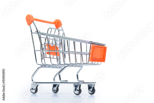 little metallic empty shopping cart isolated on white