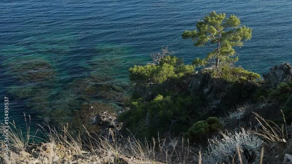 Picturesque Mediterranean seascape in Turkey. View of a small bay near the Tekirova village, District of Kemer, Antalya Province. Picturesque Mediterranean seascape in Turkey. View of a small bay near the Tekirova village, District of Kemer, Antalya Province.