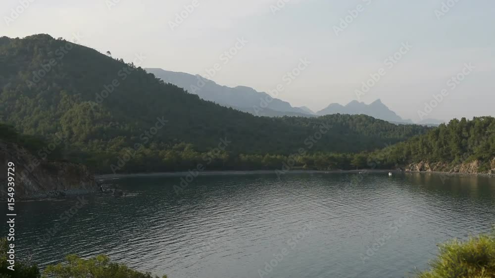 Picturesque Mediterranean seascape in Turkey. View of a small bay near the Tekirova village, District of Kemer, Antalya Province. Picturesque Mediterranean seascape in Turkey. View of a small bay near the Tekirova village, District of Kemer, Antalya Province.