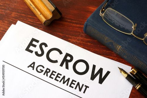 Document with title escrow agreement. photo