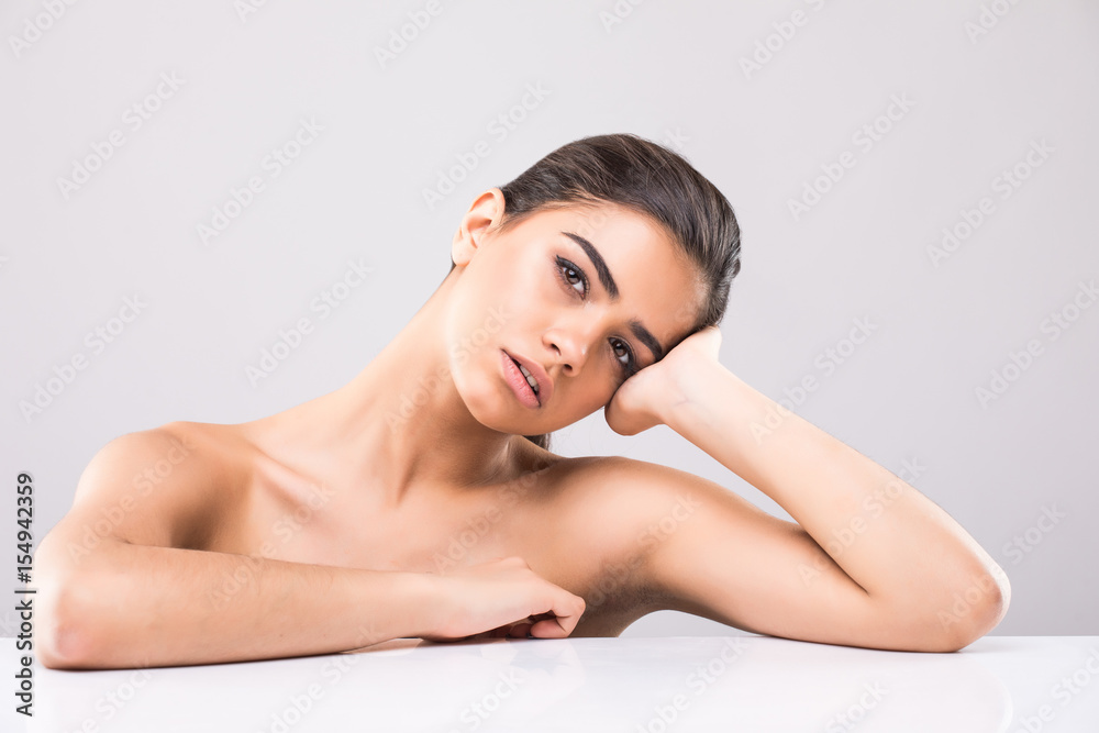 Beautiful face of young woman with clean fresh skin close up isolated on white. Beauty romantic portrait. Spa woman smiling. Perfect fresh skin. Beautiful face of young woman with clean fresh skin close up isolated on white. Beauty romantic portrait. Spa woman smiling. Perfect fresh skin.