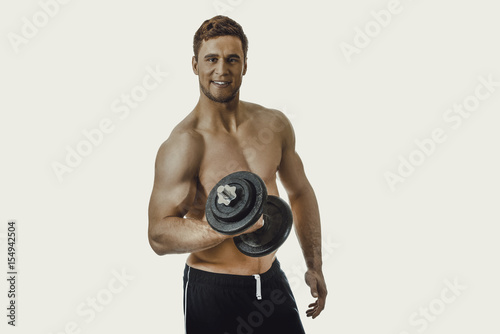 Muscular sports man weightlifting.