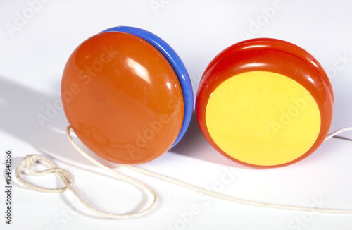 Two brightly coloured jojos isolated on a white background. photo