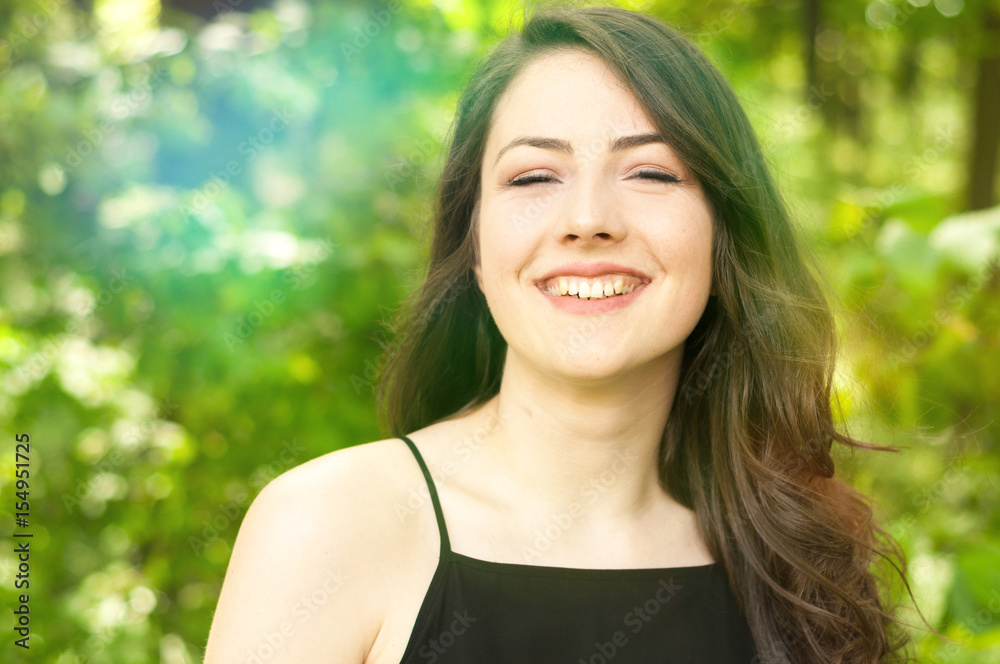Closeup portrait with flares of cheerful lady Closeup portrait with flares of cheerful lady