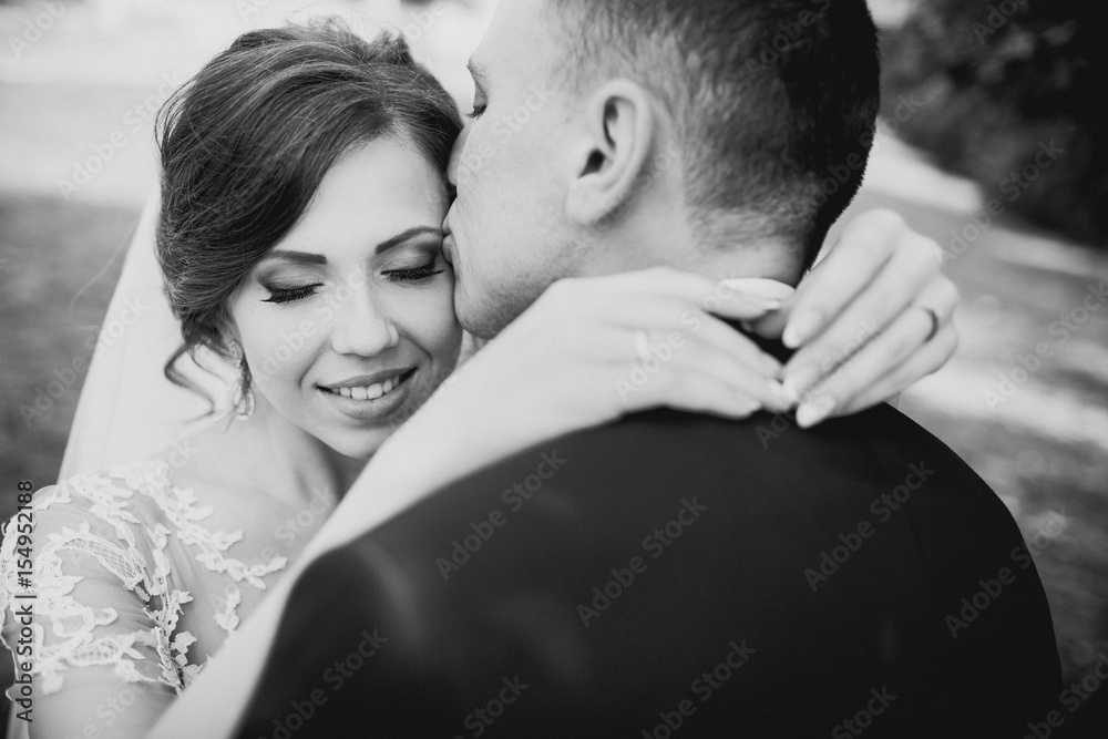 The charming brides embracing in the park The charming brides embracing in the park