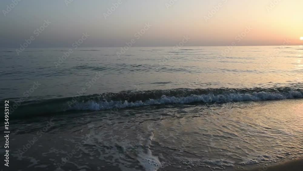 turquoise sea water waves and sand beach and blue sky. turquoise sea water waves and sand beach and blue sky.