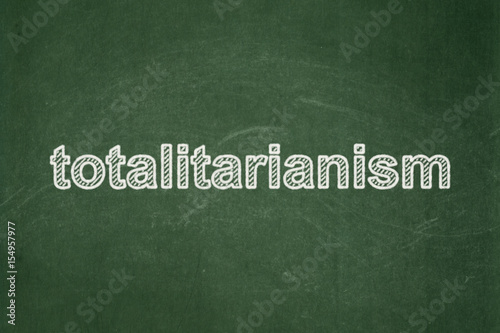 Politics concept: Totalitarianism on chalkboard background