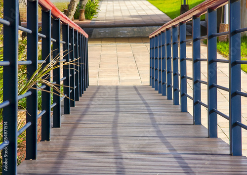 Fototapeta Naklejka Na Ścianę i Meble -  Squares and converging lines on a boardwalk at the residential precinct of the Point area in Durban.