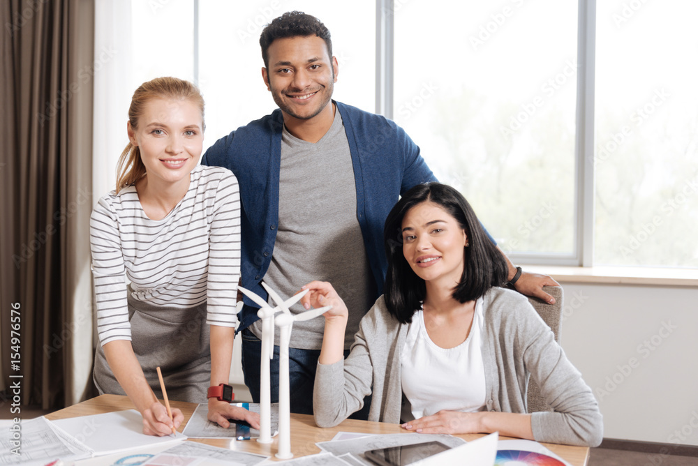 Obraz premium Joyful nice engineers looking at you