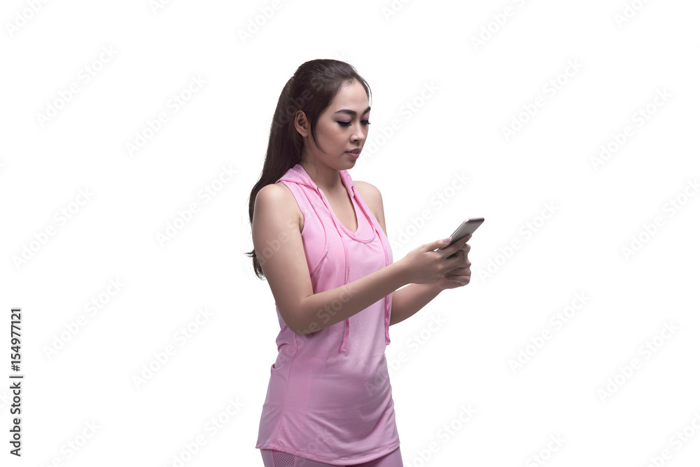Beautiful asian sporty woman using mobile phone for messaging Beautiful asian sporty woman using mobile phone for messaging