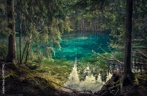 Natural spring in southern Finland. Water is so clear that it´s turquoise color. Water can be drink directly from the spring. © Jani Riekkinen