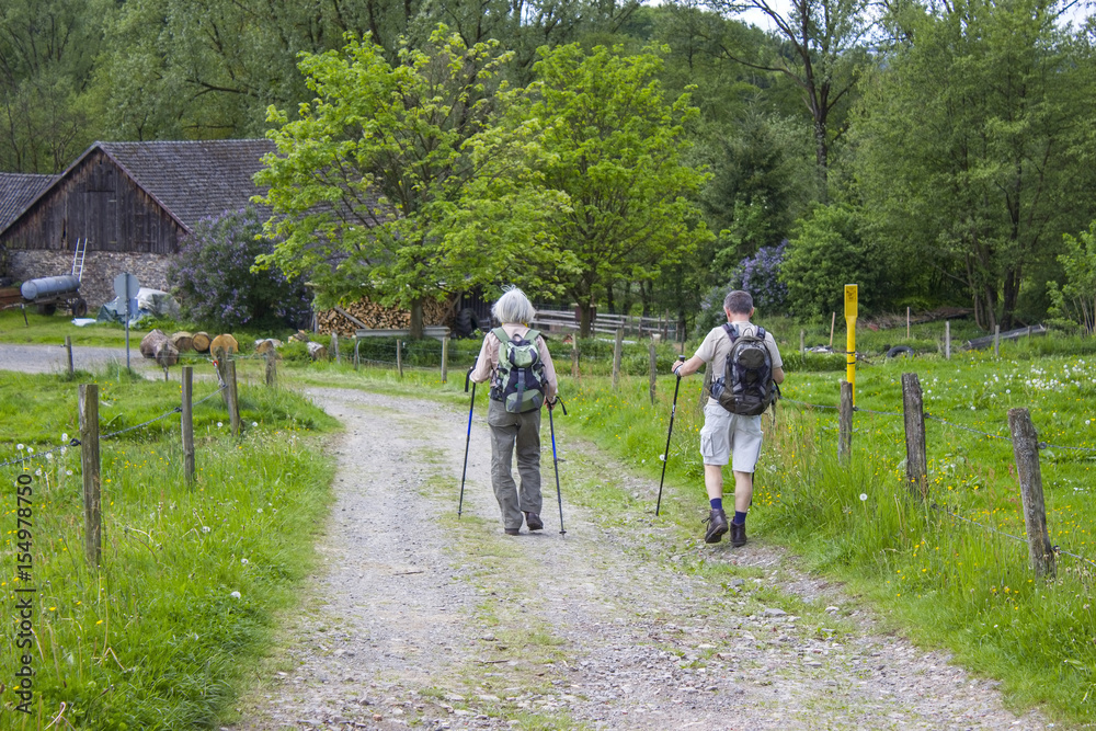 Male and female hikers in Bergisch Land, Germany. Male and female hikers in Bergisch Land, Germany.