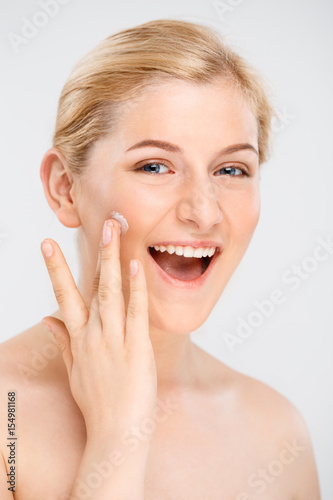 Portrait of young pretty girl over white background.