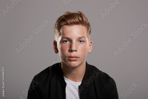 White teenage boy looking to camera, portrait,front view, horizontal