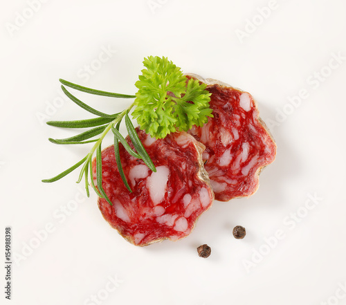 slices of dry cured salami with spices