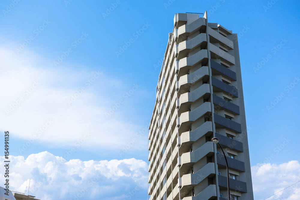 Blue sky and high-rise residential building in Japan Blue sky and high-rise residential building in Japan