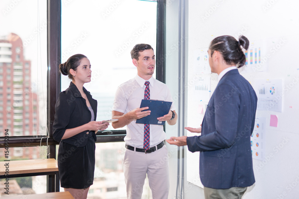 Fototapeta premium Image of business partners discussing documents and ideas at meeting Group of business people sharing their ideas.