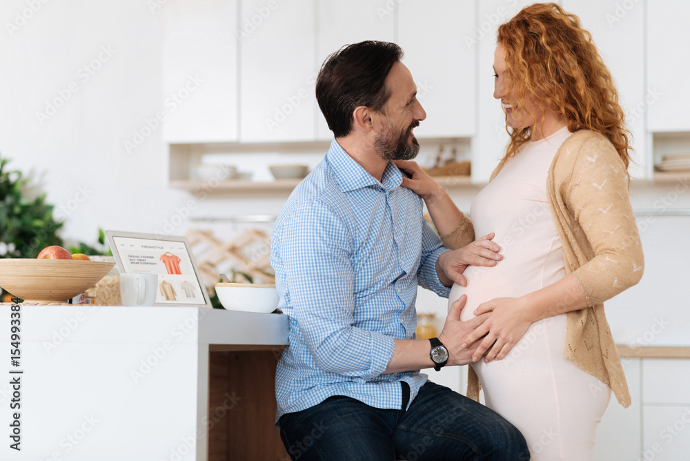 Obraz premium Mature couple feeling their baby moves