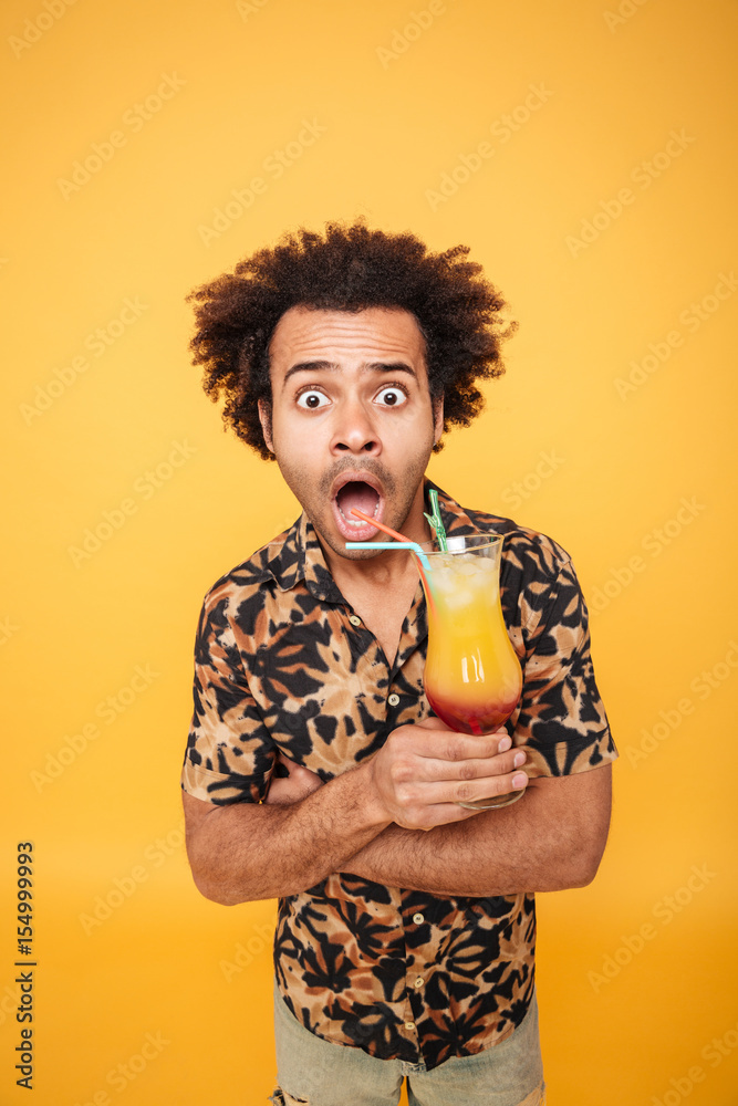 Shocked african man drinking cocktail. Shocked african man drinking cocktail.