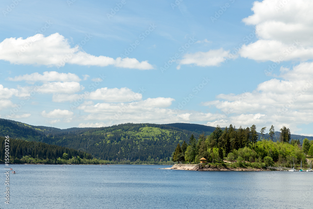 Small german lake with blue sky in the black forest Small german lake with blue sky in the black forest