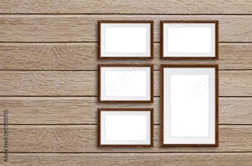 Five photo frames set on wooden panels wall, interior decor mock up © Sun-flower