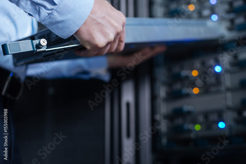 Rack server being in hands of a professional technician