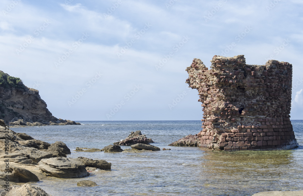 Ancient ruin of tower emerges from sea