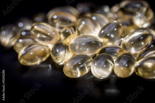 Medical pills isolated on the black background