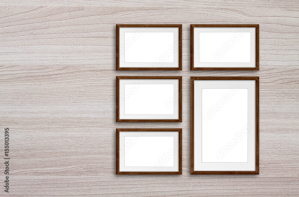 Frames set on wooden wall Frames set on wooden wall