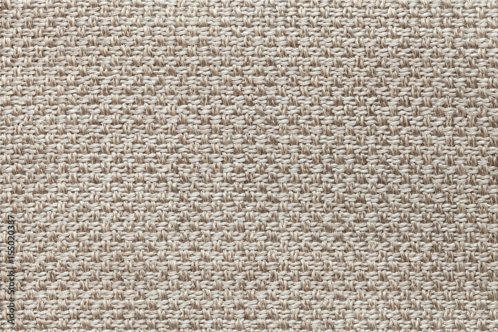Light brown textile background with checkered pattern, closeup. Structure of the fabric macro. Light brown textile background with checkered pattern, closeup. Structure of the fabric macro.