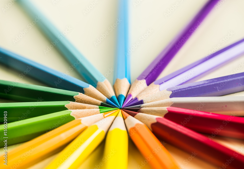 Business concept - Top view of color pencil circle on yellow paper background, teamwork, united and communication concept Business concept - Top view of color pencil circle on yellow paper background, teamwork, united and communication concept
