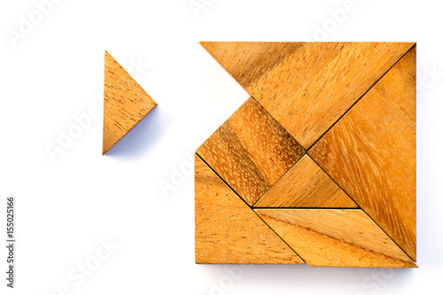 Wooden tangram puzzle in square shape wait for fulfill on white background