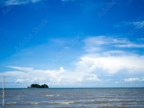 Beautiful sea in the blue sky. Island in the middle of the sea