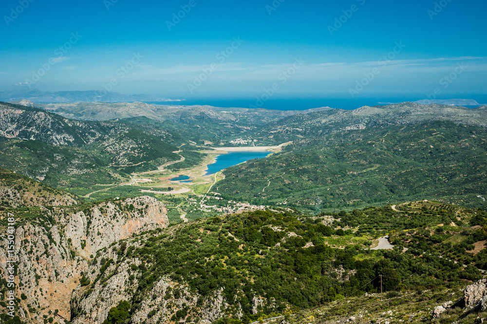 Greece, Crete, Green hills and turquoise water in bay