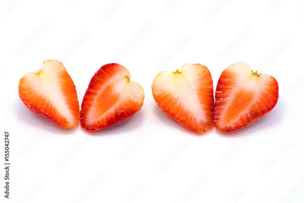 Half piece of two strawberries isolated on white background. Half piece of two strawberries isolated on white background.