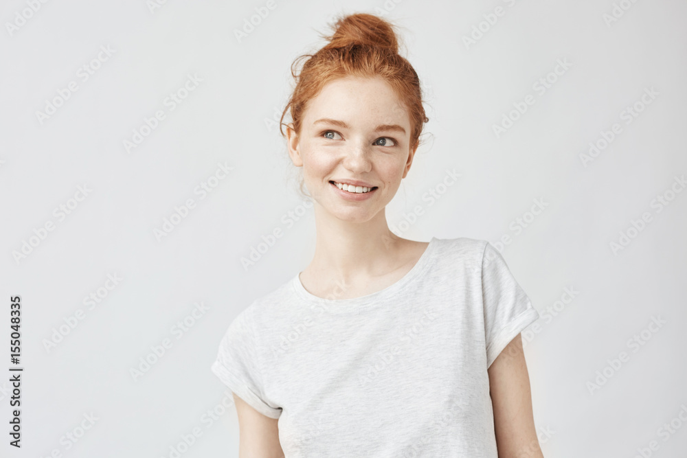 Portrait of playful beautiful ginger girl with freckles smiling. Portrait of playful beautiful ginger girl with freckles smiling.