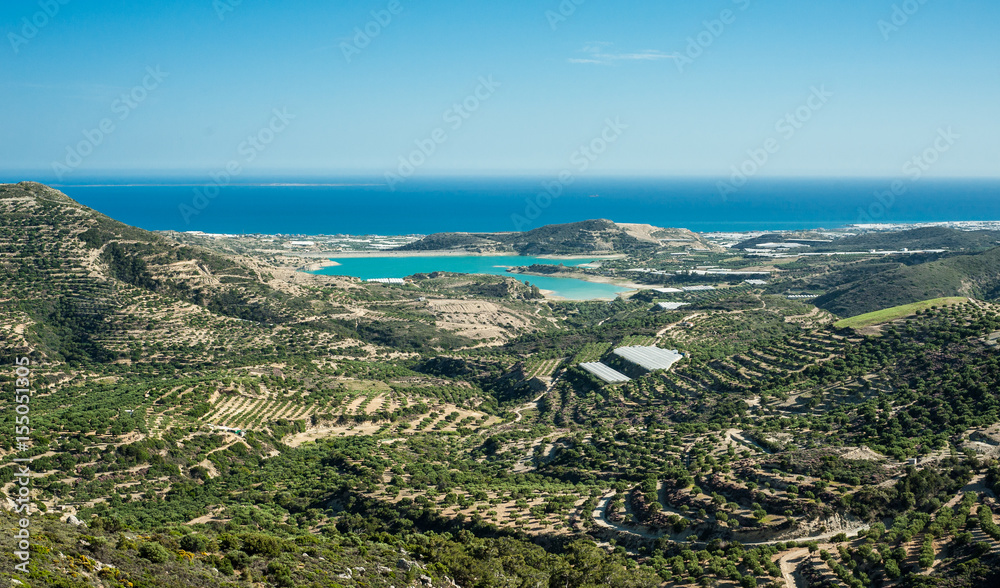 Greece, Crete, view to the green hills and sea, olives trees and sea bay
