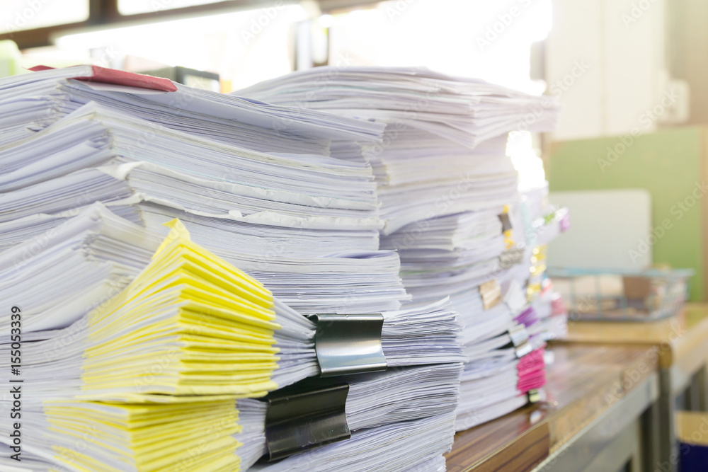 Obraz premium Pile of unfinished documents on office desk, Stack of business paper