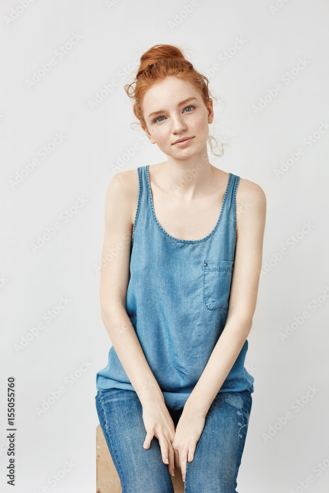 Beautiful redhead model smiling looking at camera. Beautiful redhead model smiling looking at camera.