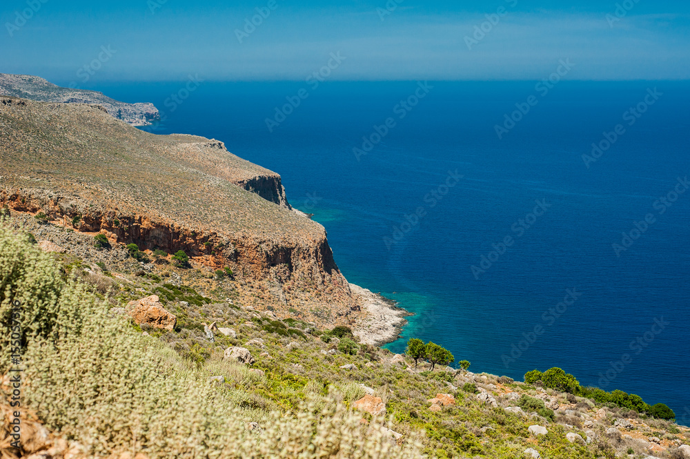 Sea coast, turquoise water and rocky hill. Road to Balos bay, Crete, Greece