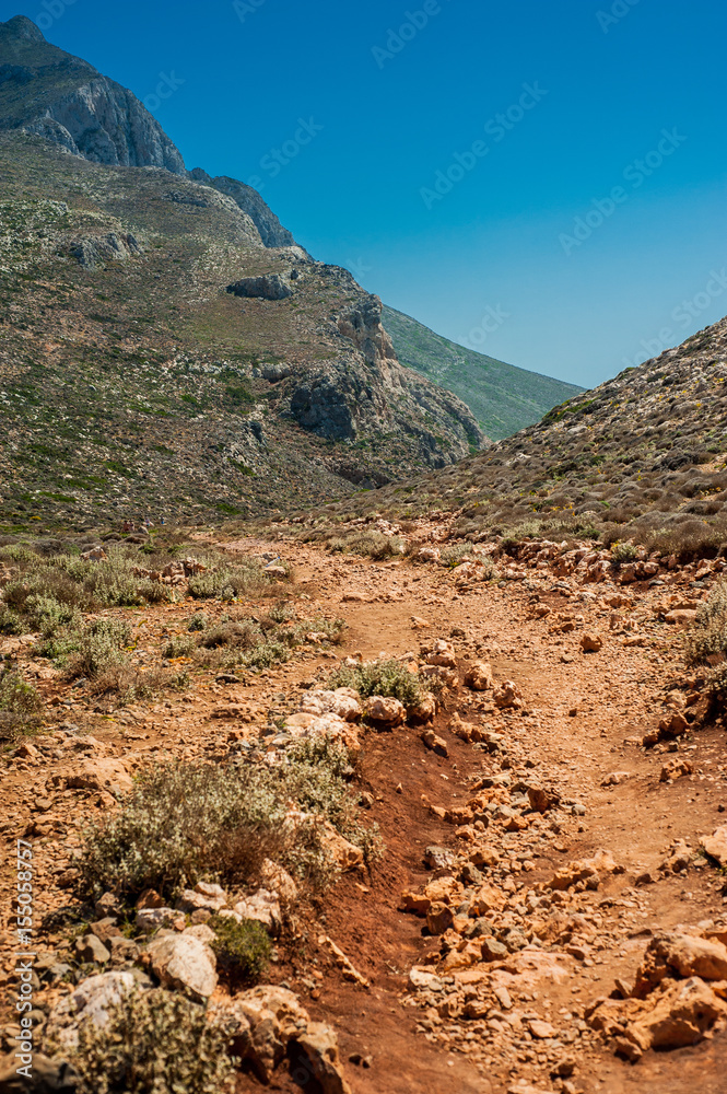 Sea coast, turquoise water and rocky hill. Road to Balos bay, Crete, Greece