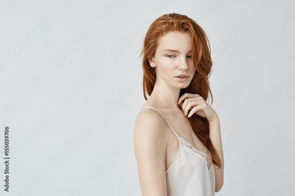 Young beautiful redhead girl posing in profile. Young beautiful redhead girl posing in profile.