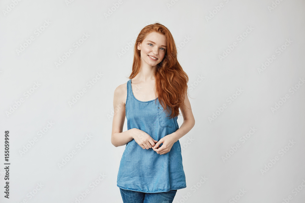 Beautiful model with foxy hair smiling looking at camera. Beautiful model with foxy hair smiling looking at camera.